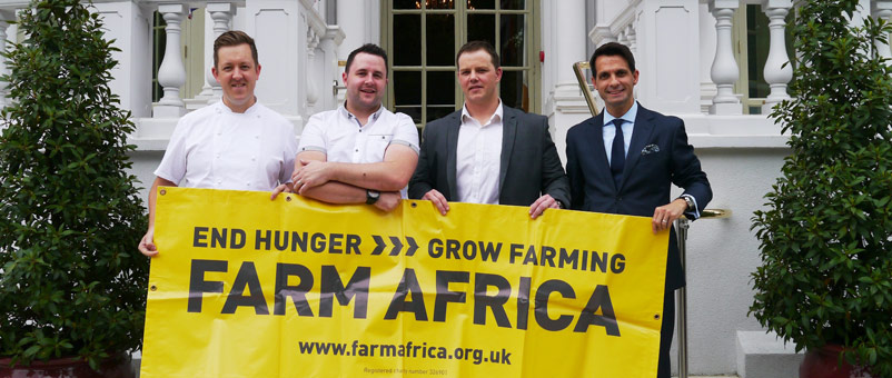 The team with Farm Africa banner at the Mandarin Oriental Hotel. (l to r: Ashley Palmer-Watts, Paul Foster, John Freeman and Paulo de Tarso)